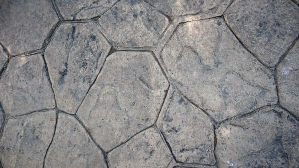 Decorative stamped concrete in Elmira NY. Stone, brick, slate, and wood patterns.